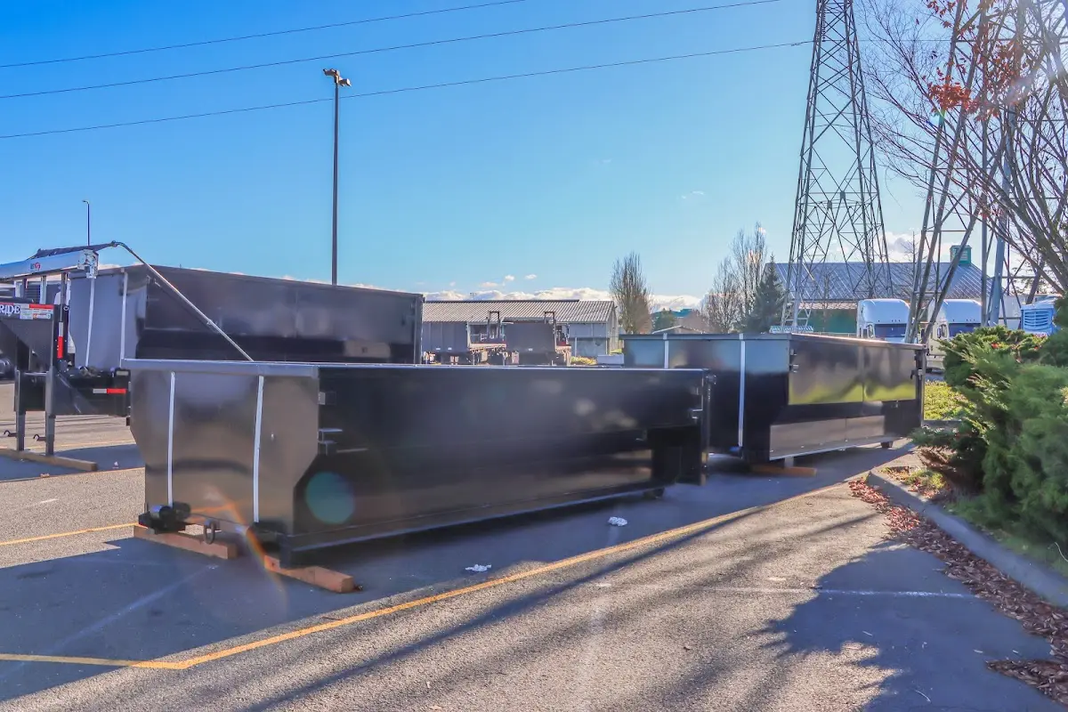 Roll-off dumpster ready for waste disposal at job site for 4 Yard Dumpster Rental in Milan